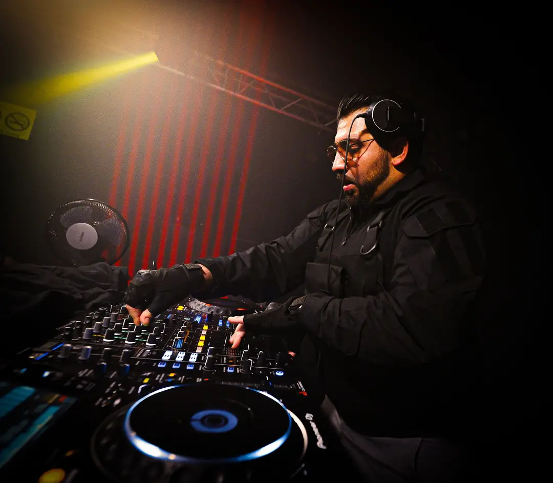 DJ at the decks during a CAVE 28 night